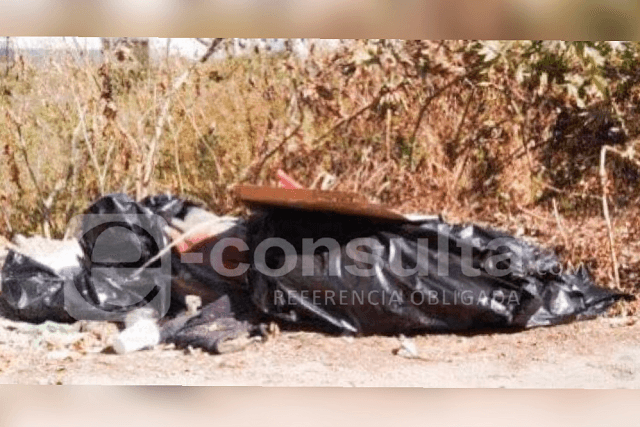 Hallan cadáver desmembrado y narcomensaje en Tecamachalco